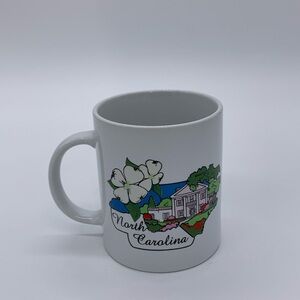 Vtg. Raleigh NC. 12 Oz Ceramic Souvenir Mug Representing State Dogwood & Capital